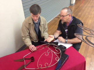 Noel Read showing a sculpture to Rick Kakol at the Geelong exhibition