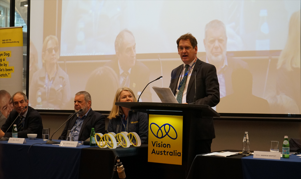 Chairperson Andrew Moffat at the lectern during the AGM.