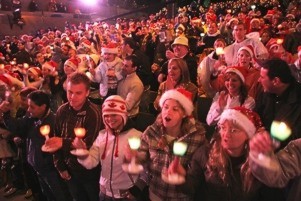 Group of Carol's goers joinng along in song