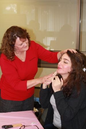 Julie shows Stella how to apply foundation