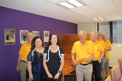 VA's Jodie Cox and Susie Barrington with members of the wood working club and the Swish table