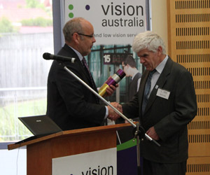 Ron presents Stephen with his award