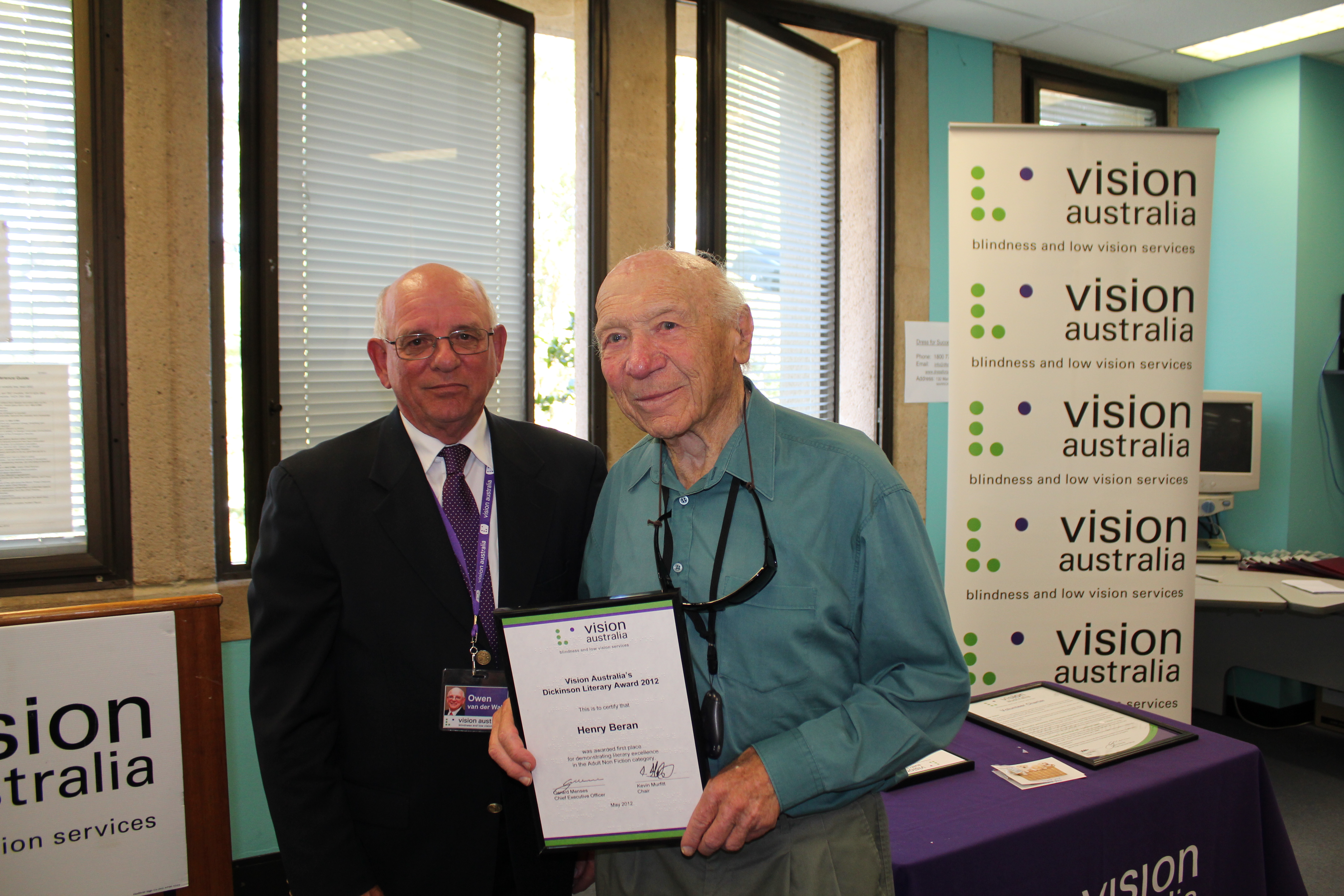 Dickinson Award winner Henry Beren holding the award in Enfield