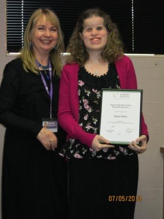 Glenda Alexander, presents Tayla Fitton with her bursary award